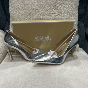 Michael Kors size 9 Silver Snakeskin with a 4” heel.  Brand new never worn.